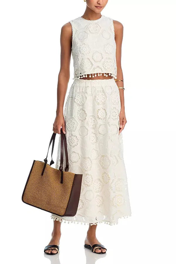 White polyester women's suit set with sleeveless top and long skirt featuring retro embroidery