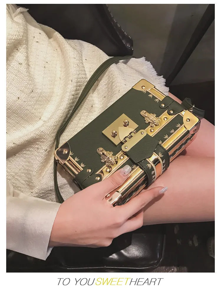 Hard-shell women's shoulder bag with single strap, flap closure, and decorative rivet details in black or green colour