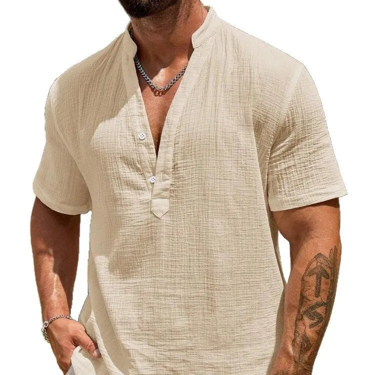 Men's solid colour stand collar short-sleeved shirt in a light blue shade on a hanger.