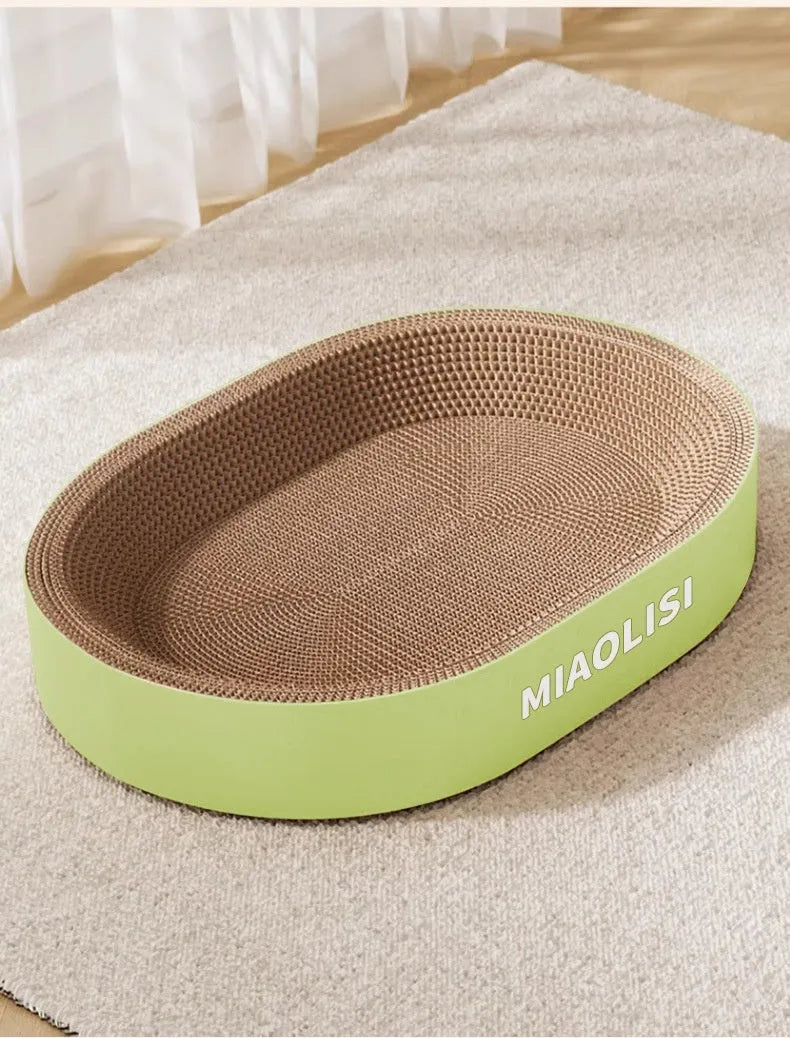 Green oval corrugated paper cat scratch board with integrated nest, 55cm diameter.