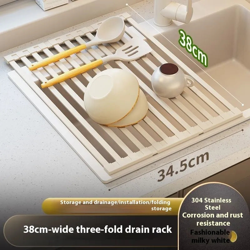 Foldable milky white stainless steel kitchen draining rack next to a sink.
