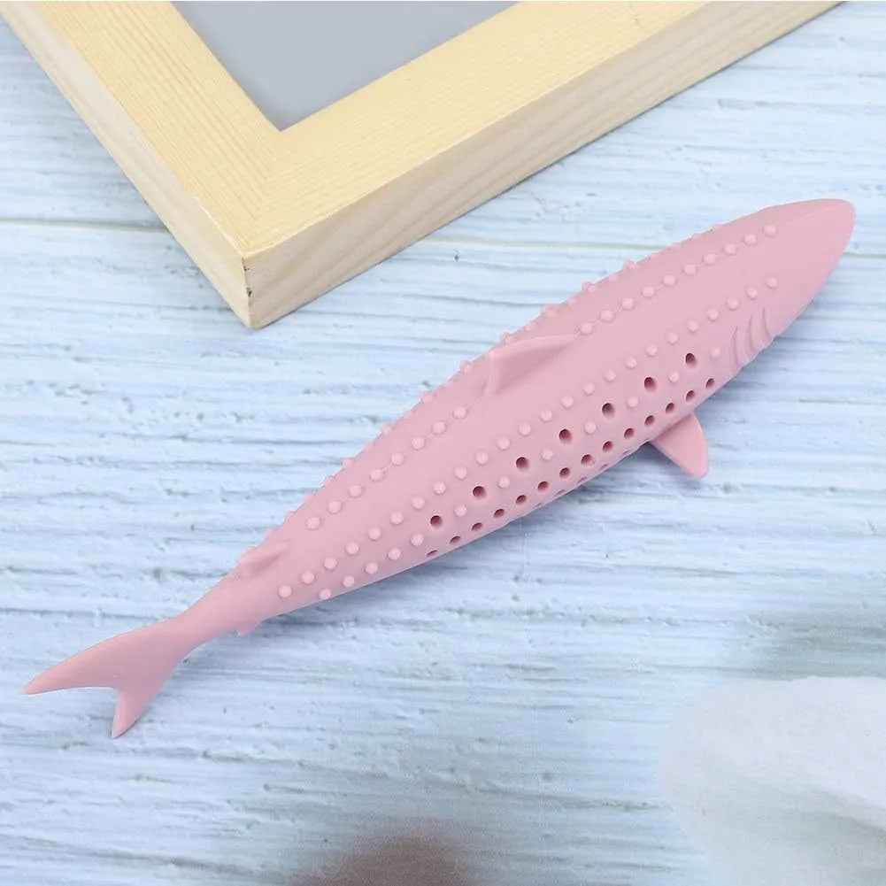 Green silicone fish-shaped chew toy for cats on a white background, showing side air holes.