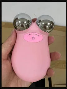 Pink micro current facial lifting device with compact shape on white background