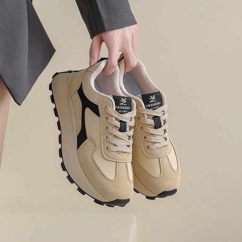 Women's solid colour low-top platform sports shoes with a rubber sole and front lace-up.