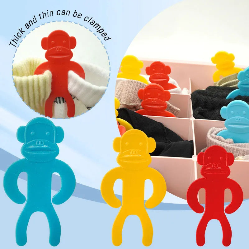 Blue, red and yellow plastic socks storage clips for washing machine organisation