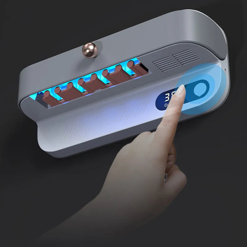 White wall-mounted smart UV toothbrush steriliser and holder with USB charging port.