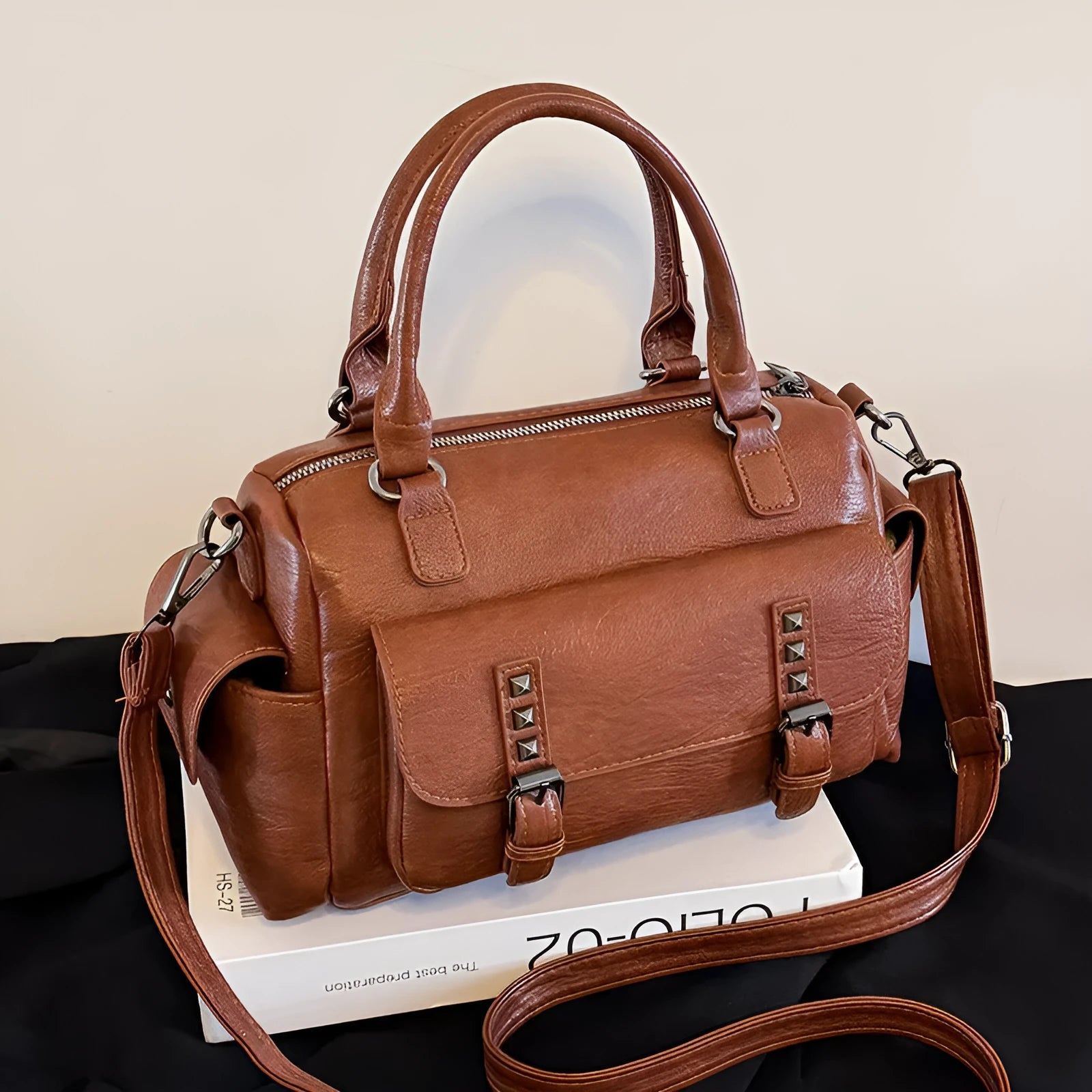 Horizontal square vintage messenger bag in PU leather with contrast stitching, shown in multiple colours.