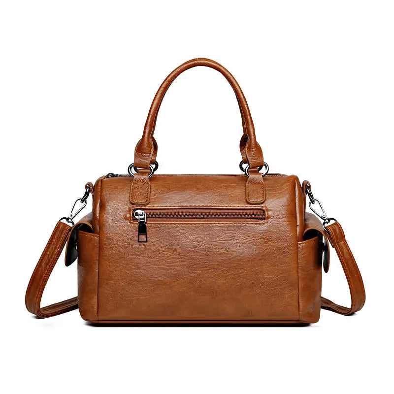 Horizontal square vintage messenger bag in PU leather with contrast stitching, shown in multiple colours.