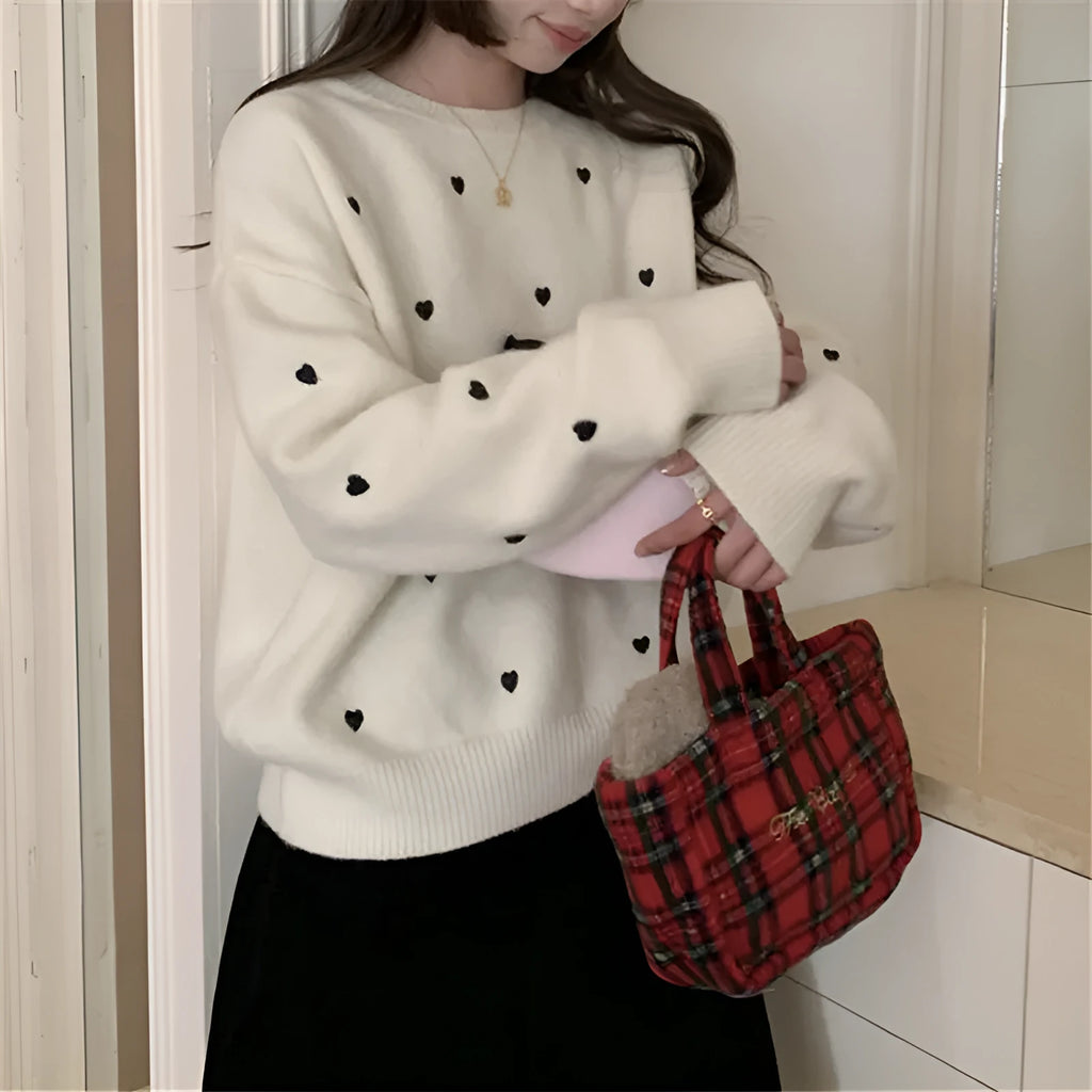 Women's loose fit acrylic pullover sweater with crew neck and embroidery details