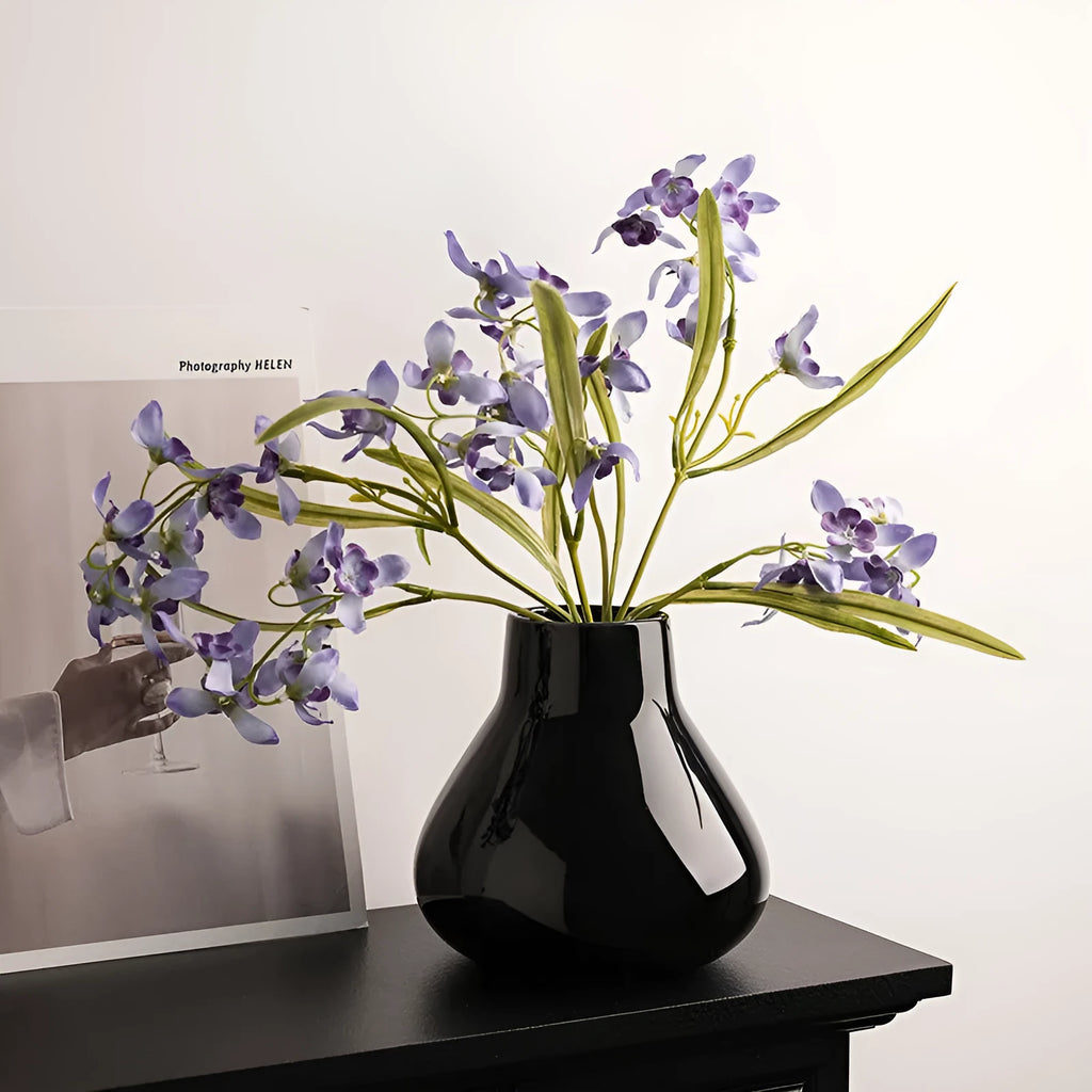 Round belly French design ceramic vase in coloured glaze finish with artificial orchid flowers