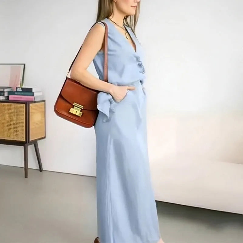 Casual white sleeveless vest and long skirt two-piece suit set on a hanger