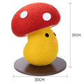 Round mushroom-shaped foldable cardboard cat scratcher lounge on a carpet.