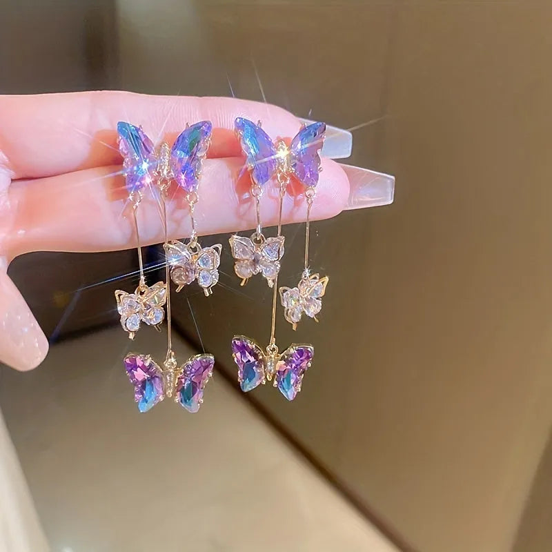 Electroplated blue purple butterfly tassel earrings with silver needle crystal flowers for women.