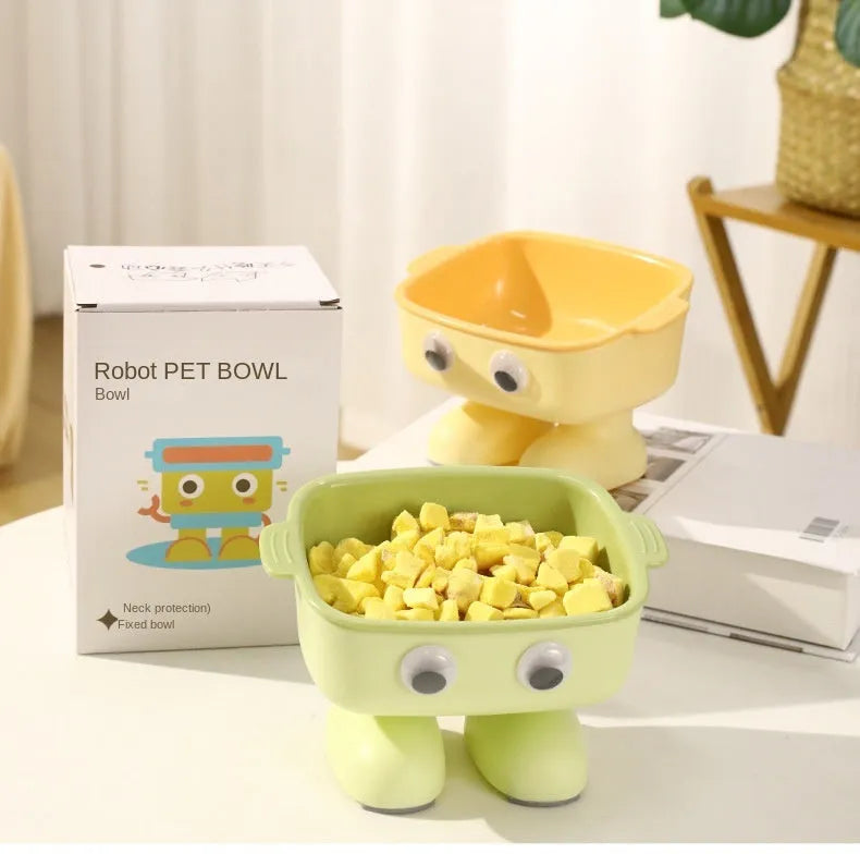 Green elevated cat bowl with robot shape design on anti-slip base showing tilted angle for feeding
