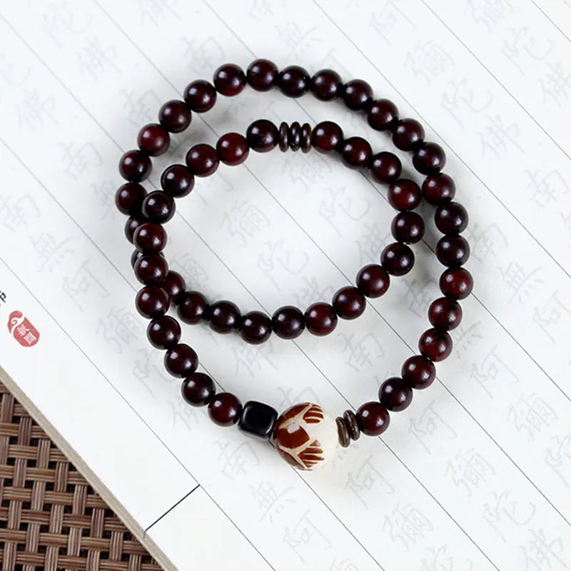 Natural rosewood knitted unisex bracelet with 10mm flower-shaped beads double circle on white background