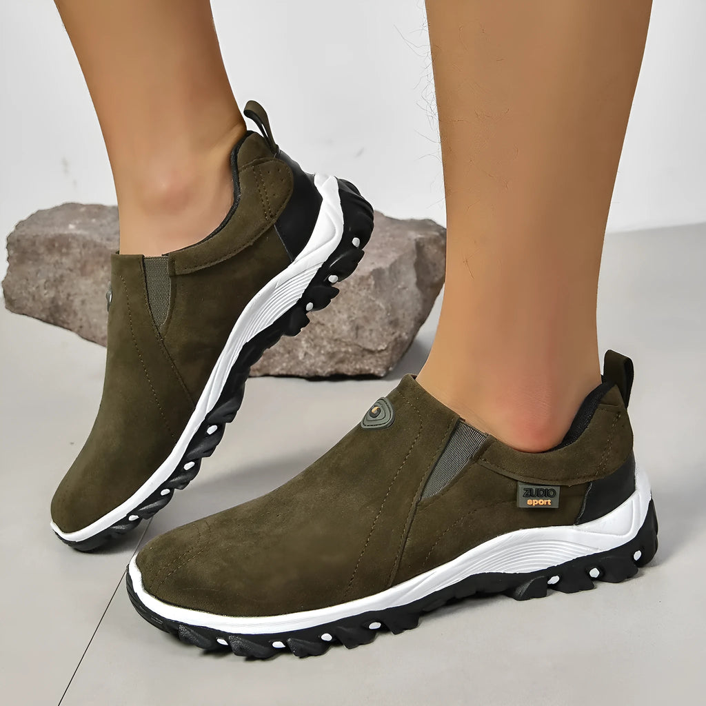 Men's thin grey overshoes with round toe, rubber sole, and shallow mouth design shown on a foot.