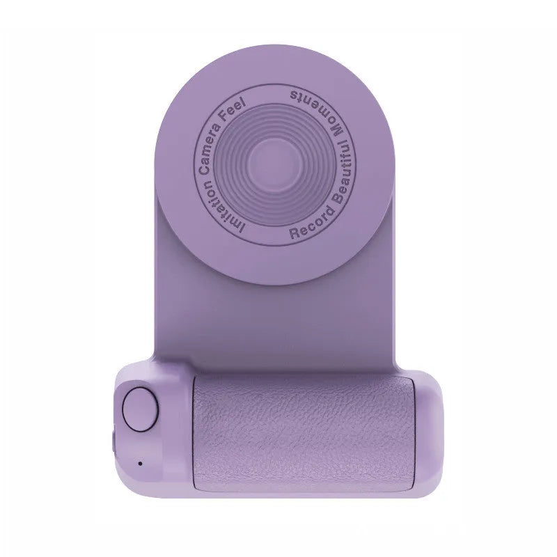 Black 3-in-1 magnetic phone camera holder with ergonomic handle on a wooden table.