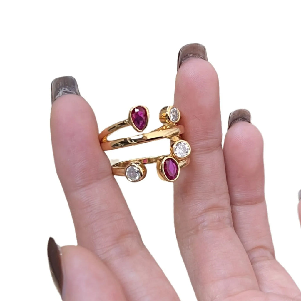 Geometric double-headed copper ring with irregular cross design and diamonds in two-tone colours.
