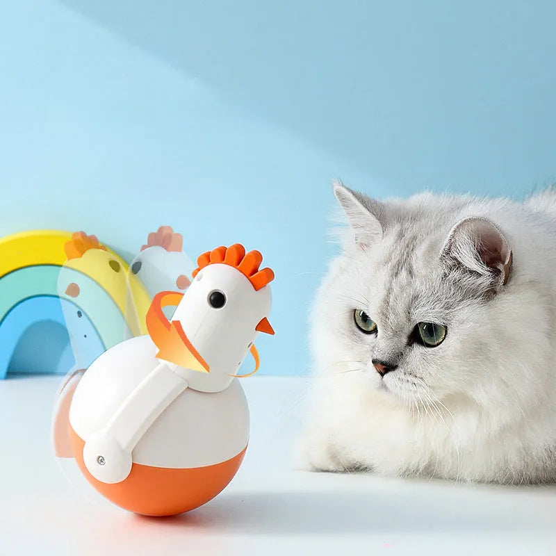 Green electric cat toy chicken with laser light and sound functions on flat surface