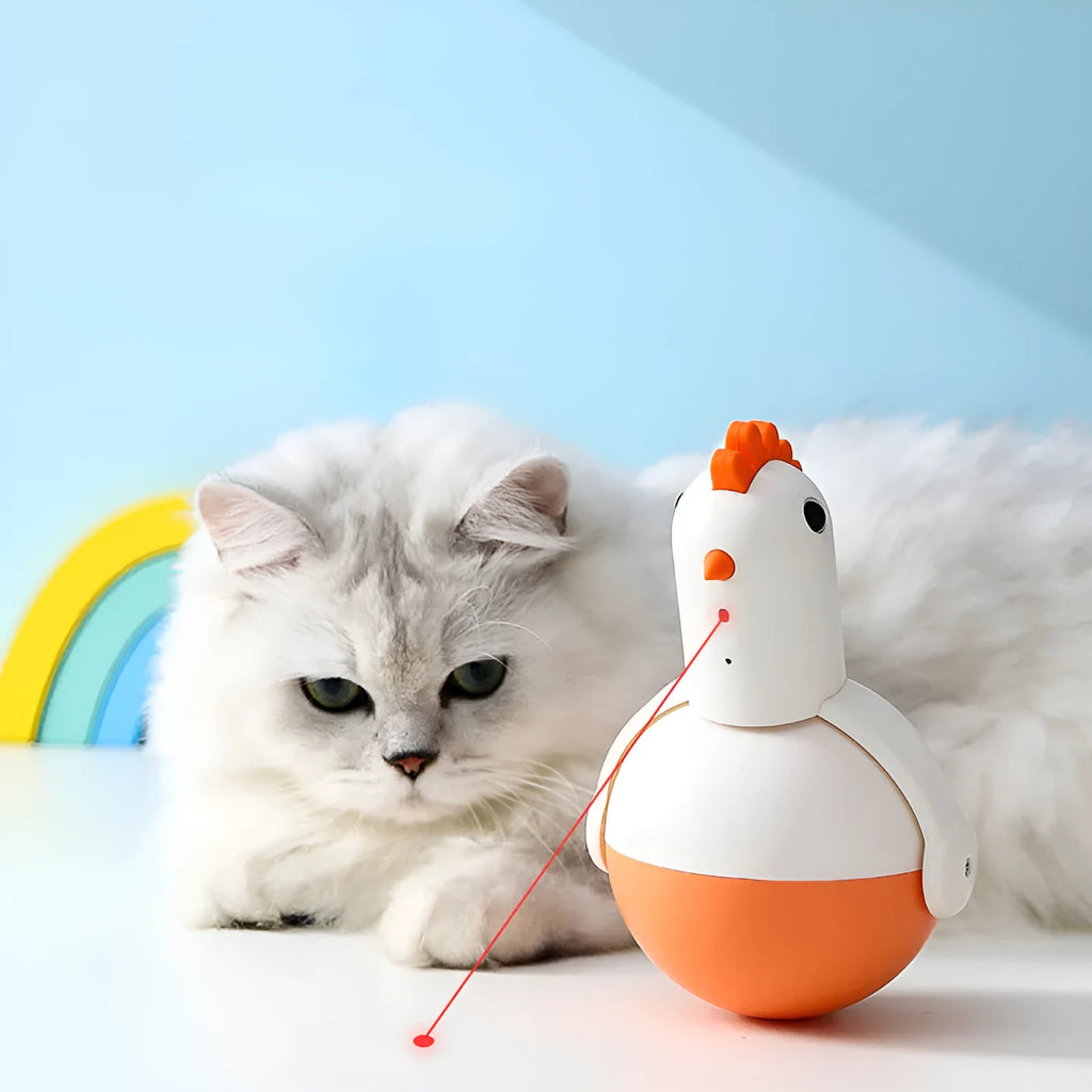 Green electric cat toy chicken with laser light and sound functions on flat surface