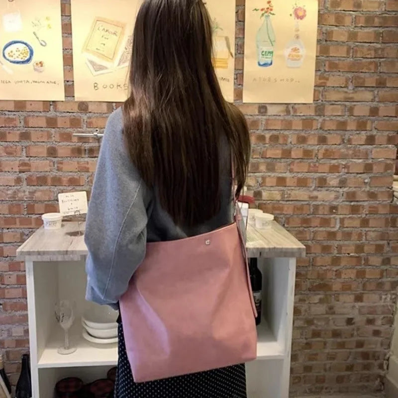 Corduroy one-shoulder commuter bag in pink colour with structured bottom