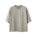 Men's sand grey short sleeve pullover showing loose fit and regular sleeve construction