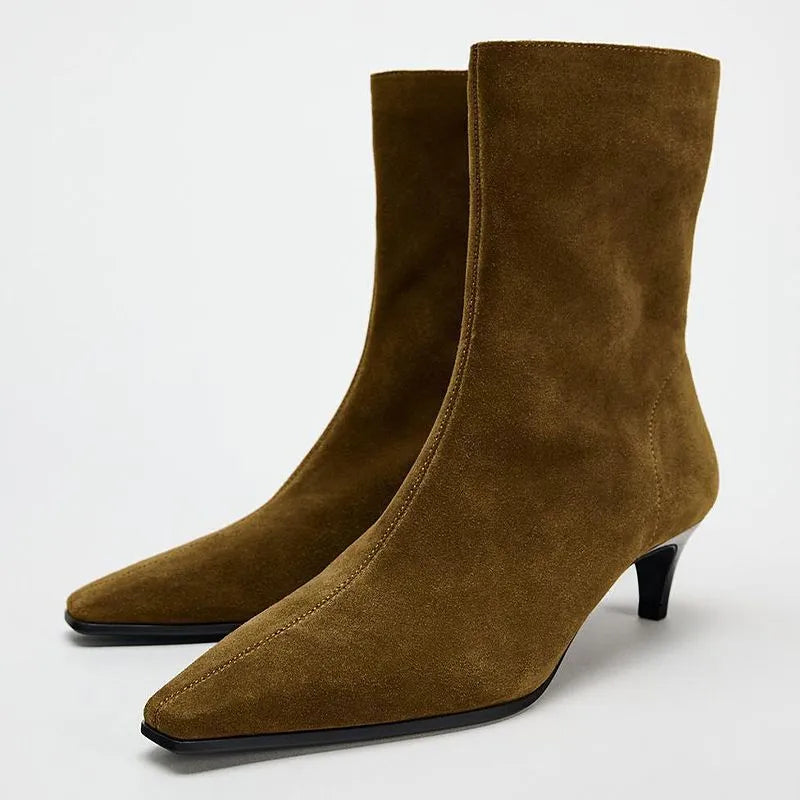Brown square toe high heel boots with side zipper and a kitten heel on a waterproof platform sole.