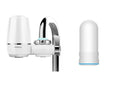 White kitchen tap water filter with ceramic cartridge and universal adapter fittings
