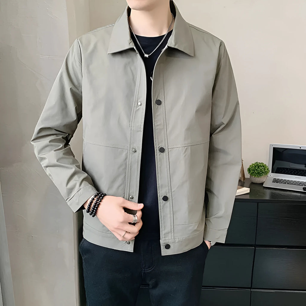 Men's Korean style thin single layer jacket in grey tones, with long sleeves, shown on a hanger.