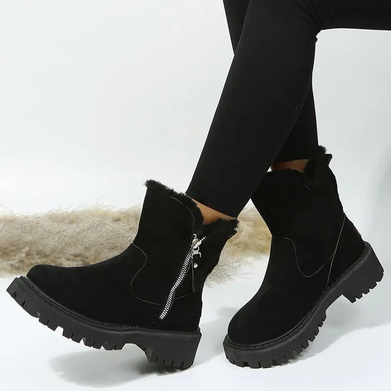 Women's black thick plush snow boots with faux suede upper, side zip, and non-slip rubber sole.