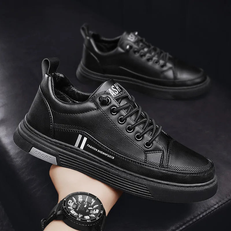 Men's low-top black and white skateboard shoes with elastic band closure and round toe.