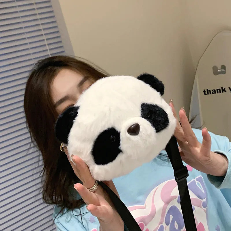 Plush panda head design cylindrical crossbody bag measuring 18cm wide