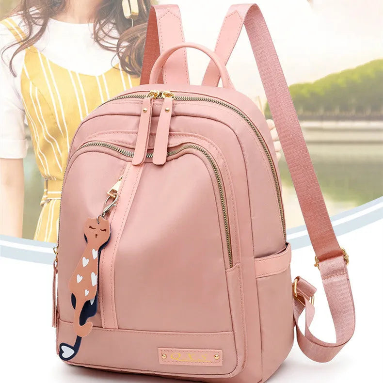 Black casual nylon backpack with shoulder straps showing internal organisation compartments