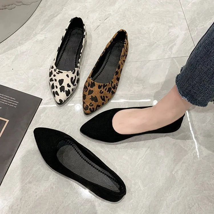 Women's flat pointed toe pumps with leopard print, cotton cloth upper, and low flat heel