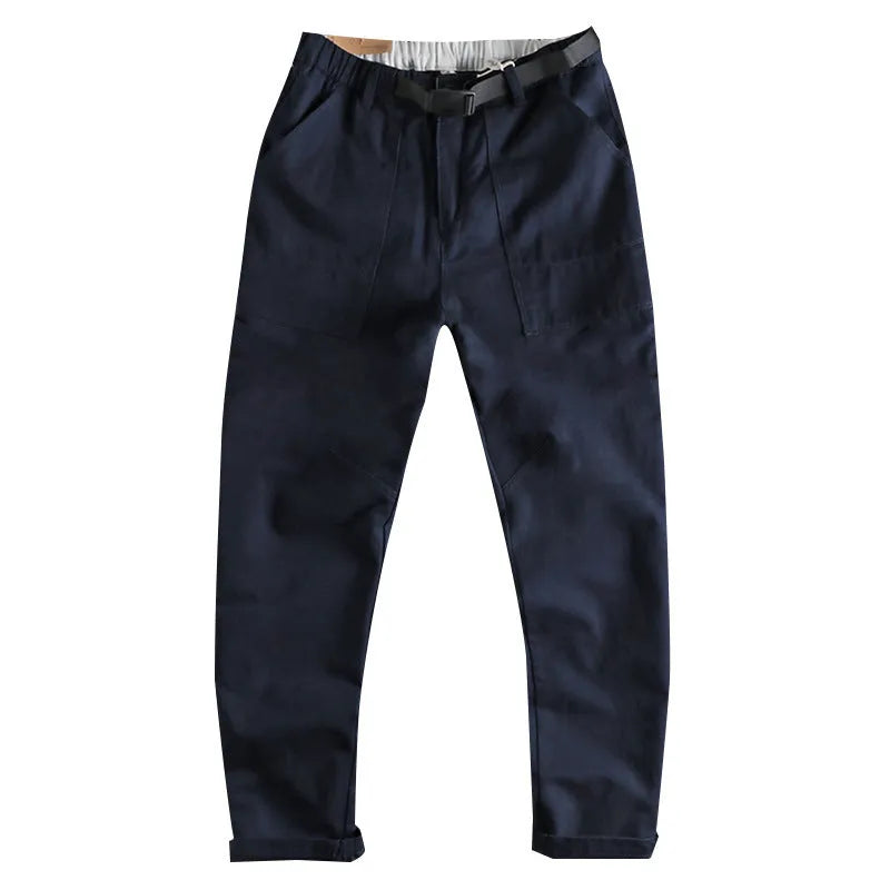 Men's dark blue cotton work trousers with flat front design and straight leg.