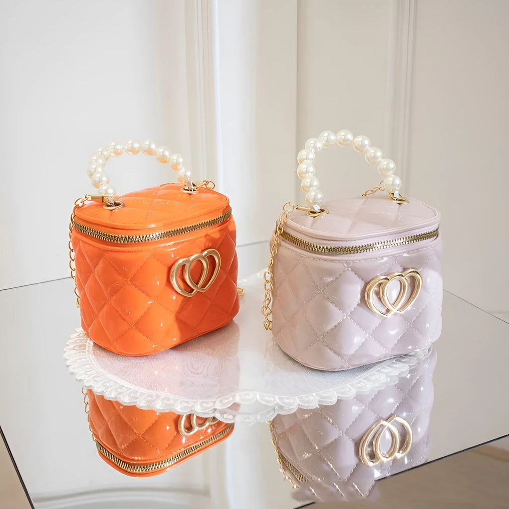 Heart-shaped pattern on a PVC bucket-style gel cosmetic bag in apricot colour.