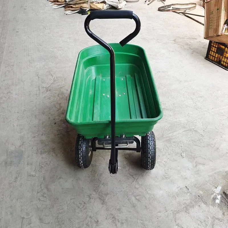 Green four-wheel plastic dump truck with steel frame and tipping bed for agricultural use.