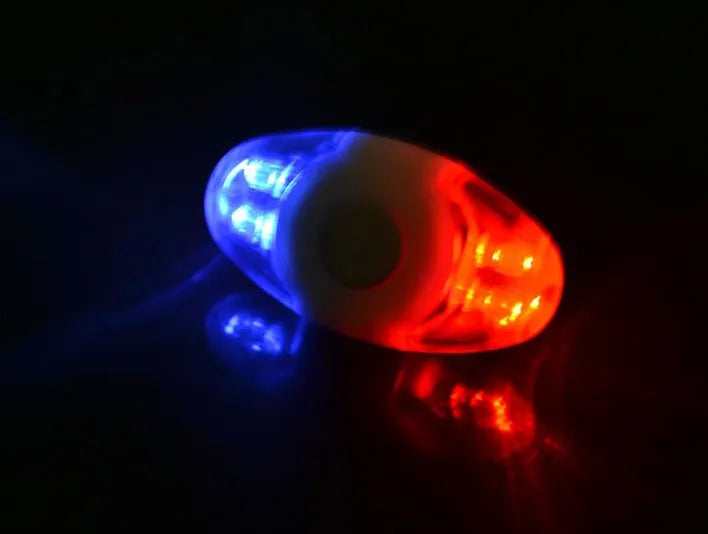 Red and blue LED bicycle tail light with adjustable mounting base shown in horizontal and vertical positions.