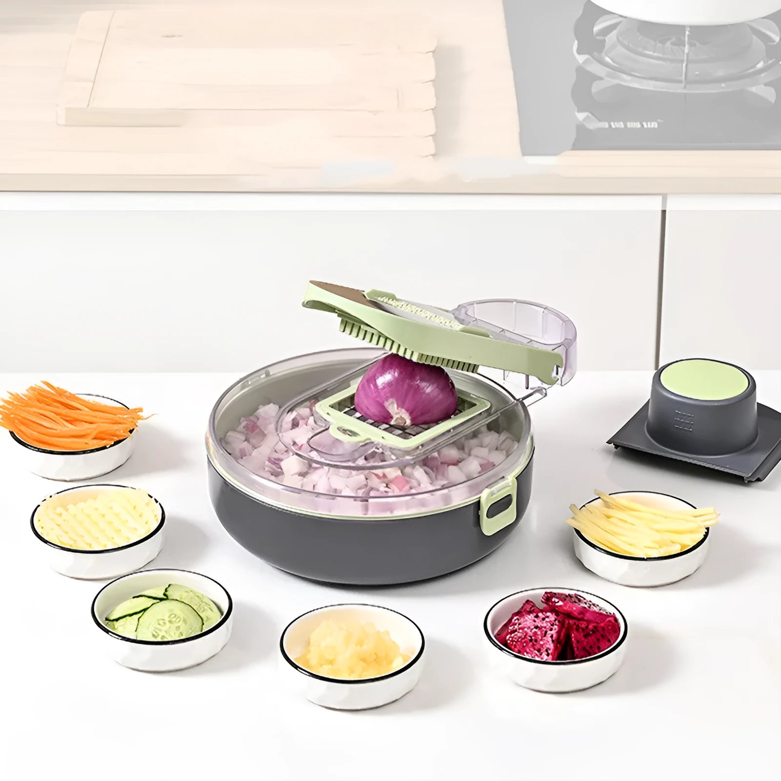 Grey multifunctional vegetable cutter with 8 knives in ABS and stainless steel, on a kitchen counter