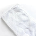 Silk bouquet wrap fabric 60x60cm in grey, folded on a table with white flowers