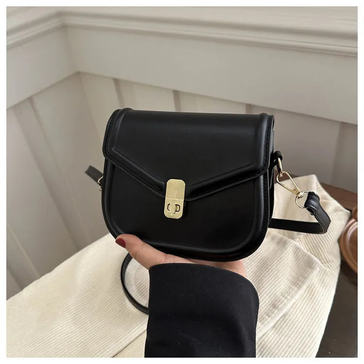 Soft PU leather clamshell shoulder messenger bag in horizontal square shape.