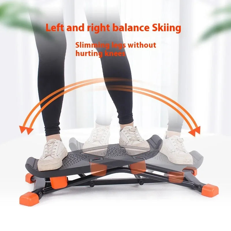 Black JS101A mini fitness skiing machine with elastic hand straps on a home floor
