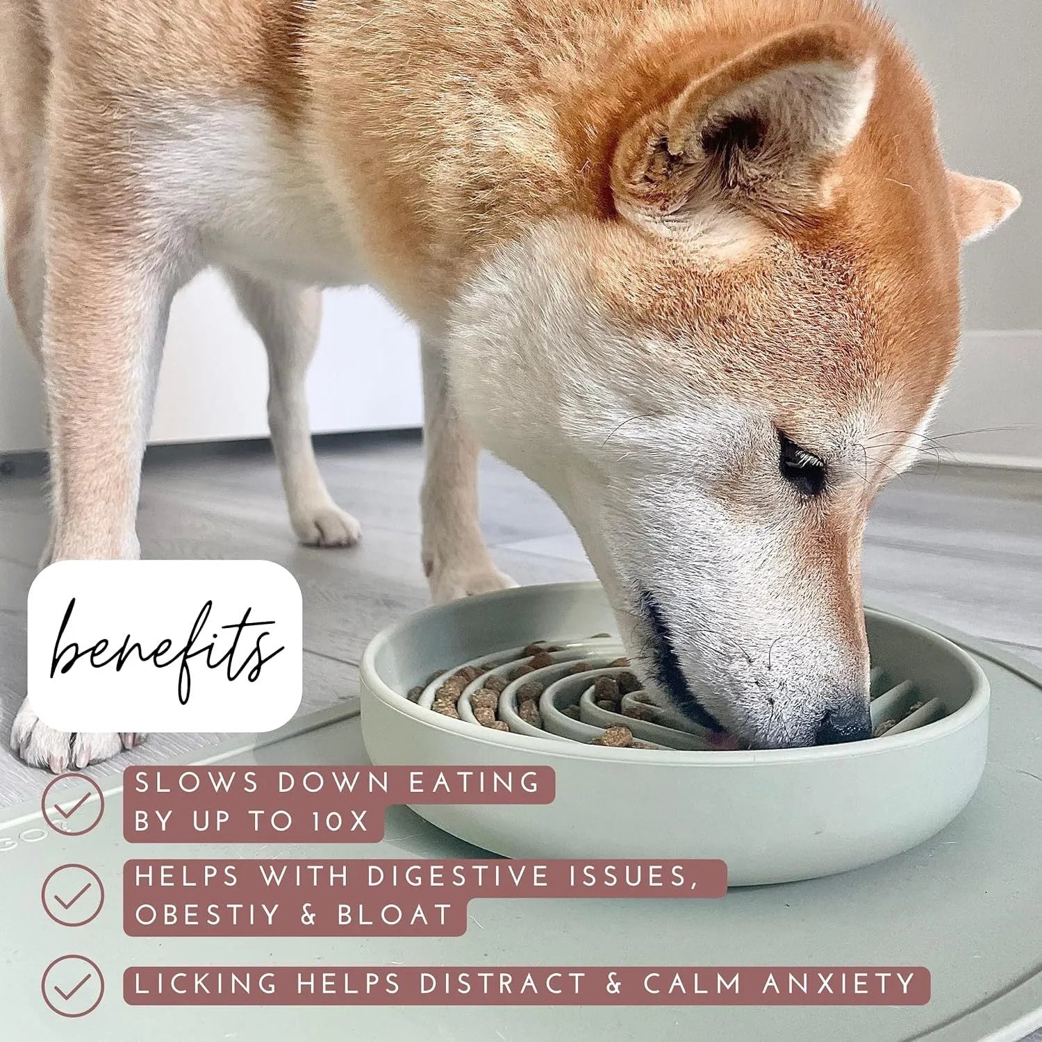 Silicone dog slow feeder bowl with ridge design in various colours on a kitchen counter.