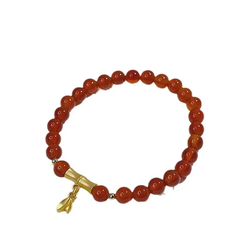 Red agate bracelet for women with Chinese style dragon motif, handmade from natural stone