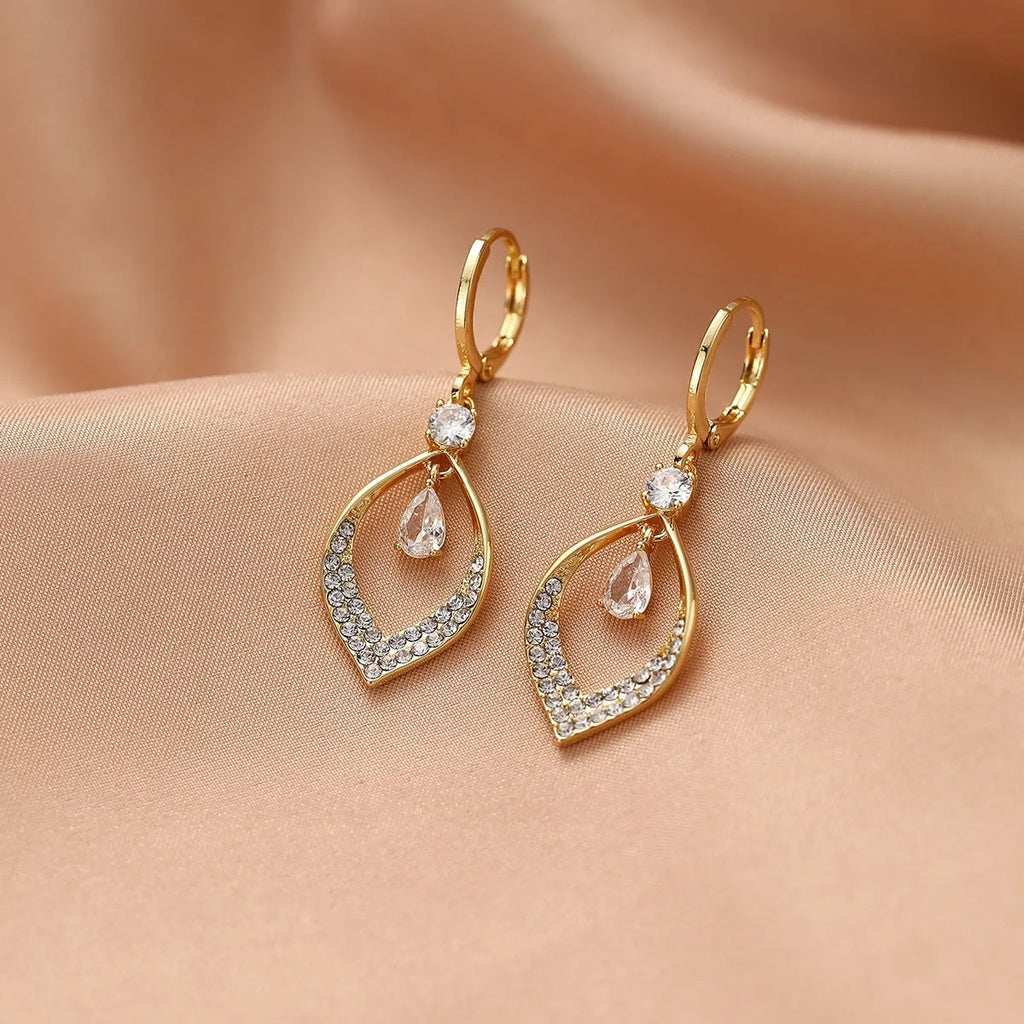 Gold and silver women's drop tassel earrings with zircon detail on a water drop shape.