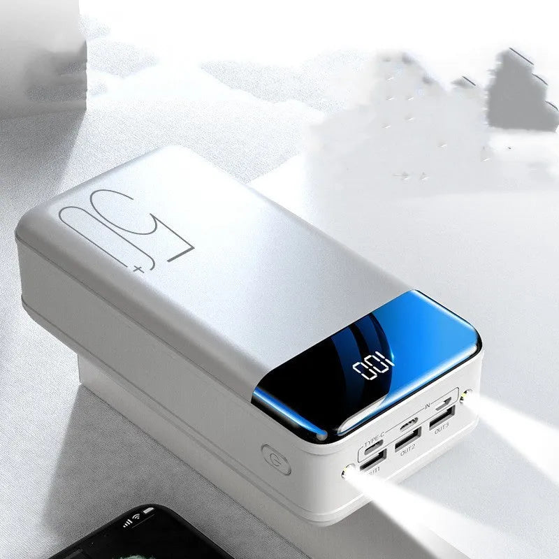 Large black power bank showing three output ports and display screen measuring 169mm