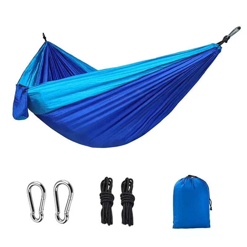 Blue nylon parachute cloth outdoor hammock with 300kg capacity hanging between trees