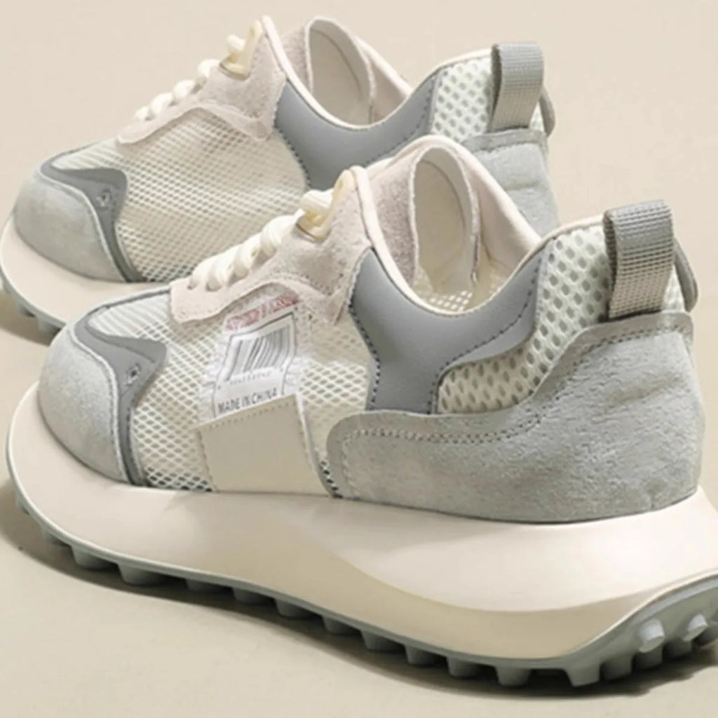 Women's grey and pink retro sneakers with low-top design and round toe