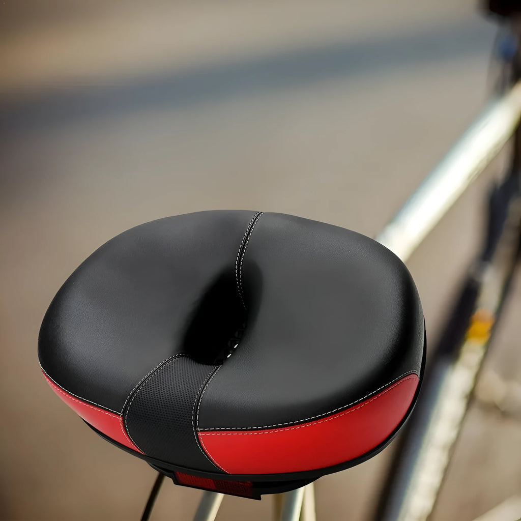 Thickened plus size mountain bike saddle in red, grey, or light brown with shock absorber and reflective stickers.