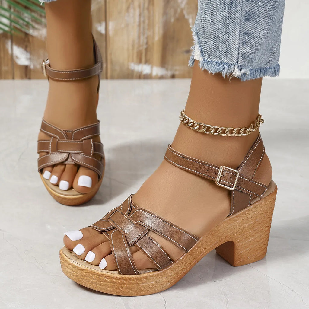 Plus size Roman peep toe chunky heel sandals with ankle buckle in black, brown, white options on display